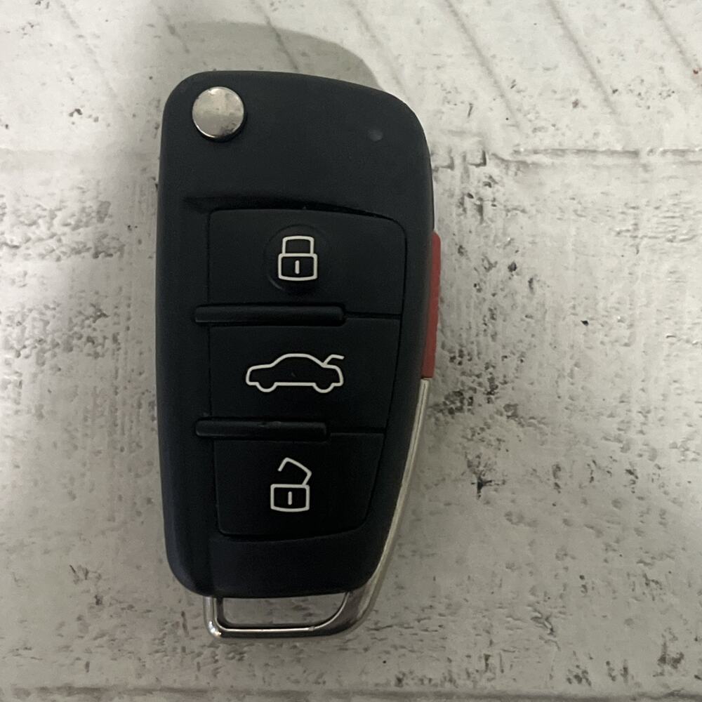 USED OEM AUDI 4-BUTTON REMOTE TRANSMITTER - NBGFS127M FS12P71M